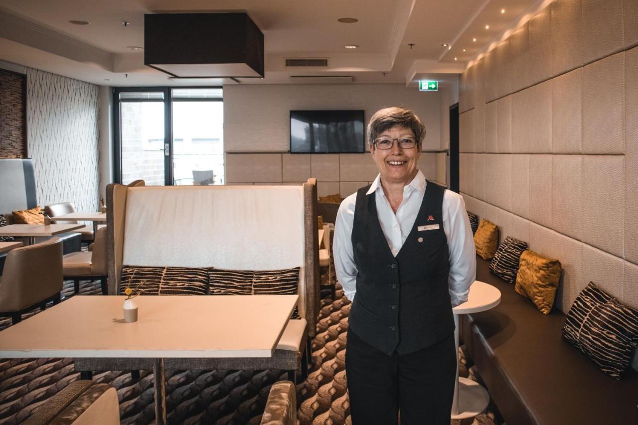 Cologne Marriott Hotel Kültér fotó A flight attendant in the new uniform